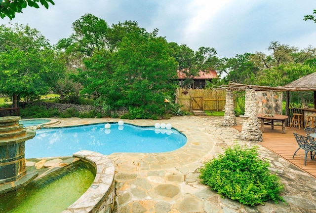 0000 Oakwood Loop, San Marcos, TX 78666 - view of pool with a pool with connected hot tub and a deck