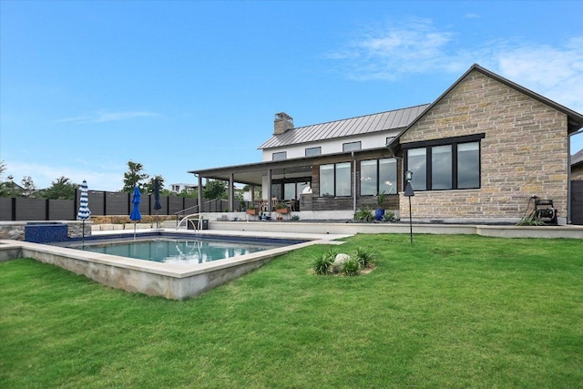 416 Kayak Way Unit 1, Austin, TX 78738 - rear view of house with stone siding, a chimney, a standing seam roof, and a metal roof