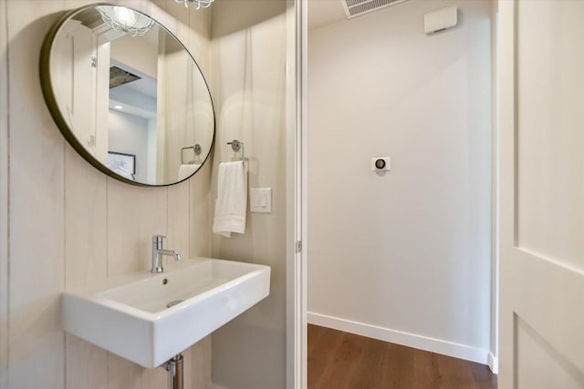 416 Kayak Way Unit 1, Austin, TX 78738 - bathroom with baseboards, wood finished floors, and a sink