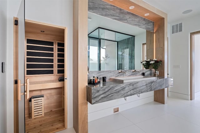 204 Wennmohs Pl, Horseshoe Bay, TX 78657 - bathroom featuring a relaxing sauna, vanity, tile patterned floors, and a shower with shower door