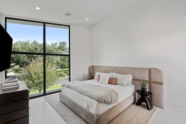 204 Wennmohs Pl, Horseshoe Bay, TX 78657 - tiled bedroom featuring floor to ceiling windows and recessed lighting