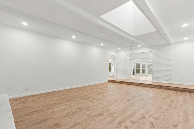 4202 N Hills Dr, Austin, TX 78731 - unfurnished living room featuring recessed lighting, light wood-type flooring, arched walkways, and beamed ceiling