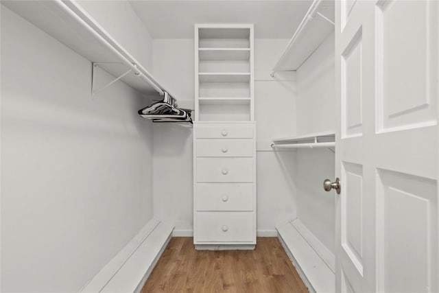 4202 N Hills Dr, Austin, TX 78731 - walk in closet featuring wood finished floors
