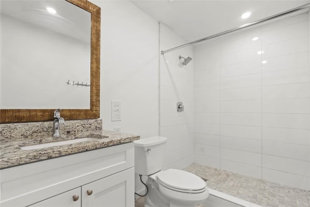 4202 N Hills Dr, Austin, TX 78731 - full bathroom with vanity, a tile shower, and recessed lighting