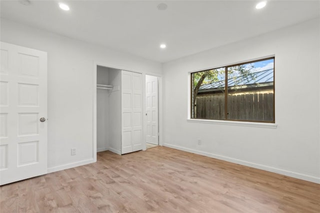 4202 N Hills Dr, Austin, TX 78731 - unfurnished bedroom with wood finished floors, recessed lighting, and a closet