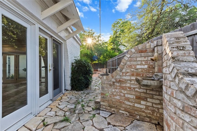 4202 N Hills Dr, Austin, TX 78731 - fenced backyard with french doors and a patio