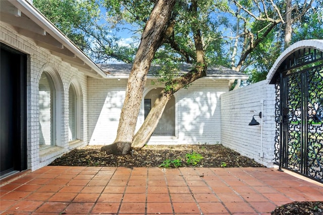 4202 N Hills Dr, Austin, TX 78731 - doorway to property with brick siding and a patio