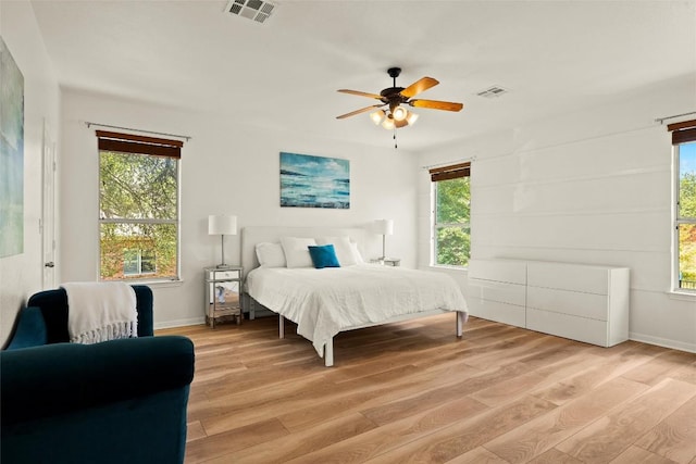 220 Grafton Ln, Austin, TX 78737 - bedroom featuring light wood finished floors, multiple windows, and baseboards