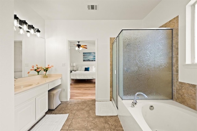 220 Grafton Ln, Austin, TX 78737 - bathroom with vanity, a bath, connected bathroom, a ceiling fan, and a stall shower