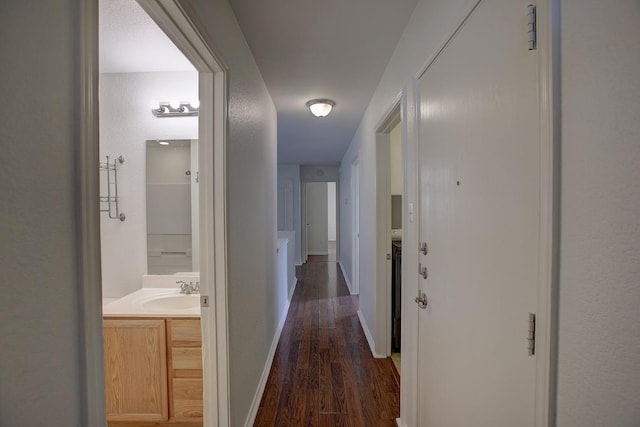 77 Jan Ln, Georgetown, TX 78626 - hall featuring dark wood-style flooring and a sink