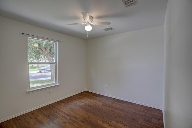 77 Jan Ln, Georgetown, TX 78626 - empty room featuring dark wood finished floors and a ceiling fan