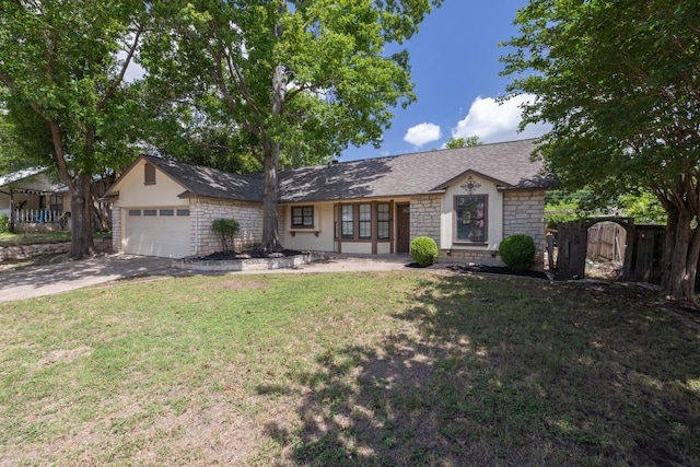 702 Westminster Pl, Round Rock, TX 78664 - ranch-style house with an attached garage, a front yard, stone siding, concrete driveway, and a gate