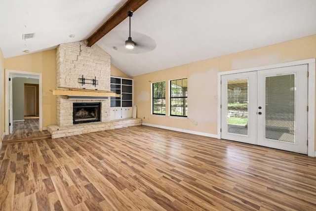 702 Westminster Pl, Round Rock, TX 78664 - unfurnished living room with wood finished floors, ceiling fan, french doors, and a fireplace