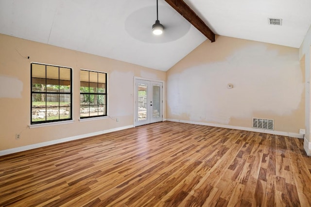702 Westminster Pl, Round Rock, TX 78664 - unfurnished room with wood finished floors, beamed ceiling, ceiling fan, baseboards, and high vaulted ceiling
