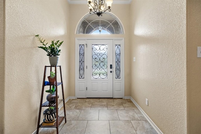 2034 Falling Leaf Ln, Harker Heights, TX 76548 - entrance foyer featuring a chandelier, a textured wall, ornamental molding, baseboards, and light tile patterned floors