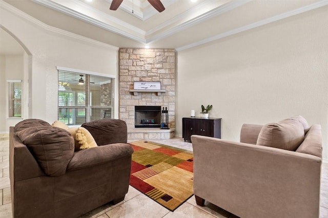 2034 Falling Leaf Ln, Harker Heights, TX 76548 - living area with ornamental molding, arched walkways, ceiling fan, a fireplace, and light tile patterned flooring