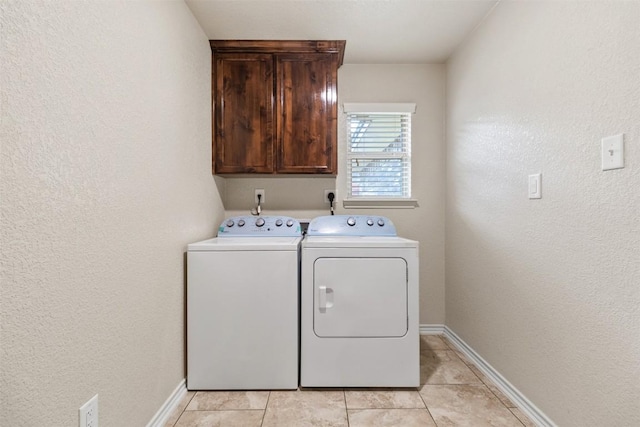 2034 Falling Leaf Ln, Harker Heights, TX 76548 - laundry room with cabinet space, washer and dryer, baseboards, a textured wall, and light tile patterned flooring