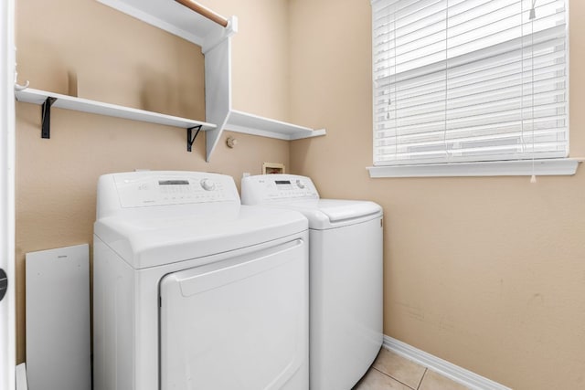 15150 Galena Dr, Austin, TX 78717 - laundry area featuring independent washer and dryer, light tile patterned flooring, and baseboards