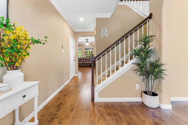 15150 Galena Dr, Austin, TX 78717 - entrance foyer with ornamental molding, a ceiling fan, light wood-style flooring, stairs, and baseboards