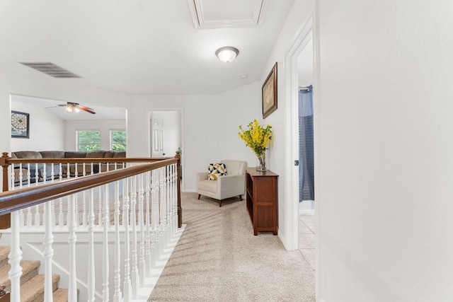 15150 Galena Dr, Austin, TX 78717 - hall with light carpet, an upstairs landing, and baseboards