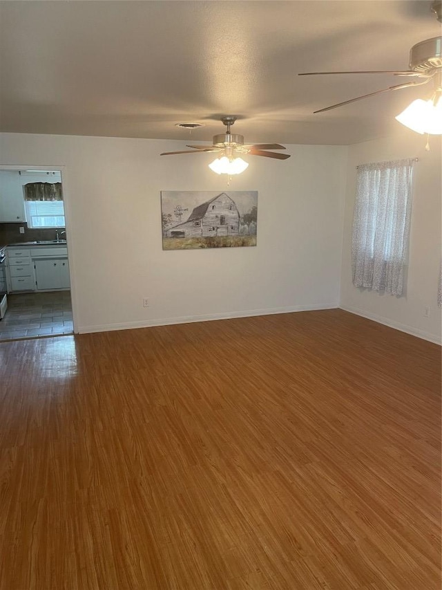 207 N 1st St, Thorndale, TX 76577 - spare room with ceiling fan and wood finished floors