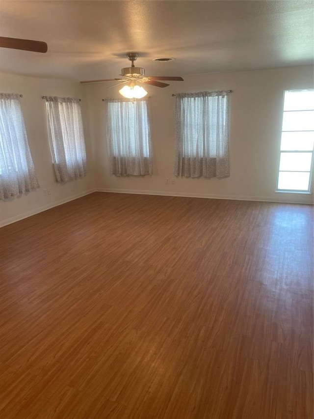 207 N 1st St, Thorndale, TX 76577 - spare room featuring wood finished floors and a ceiling fan