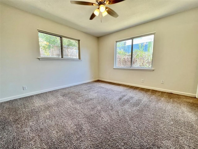 3500 Loyola Ln, Austin, TX 78723 - carpeted empty room with ceiling fan and baseboards