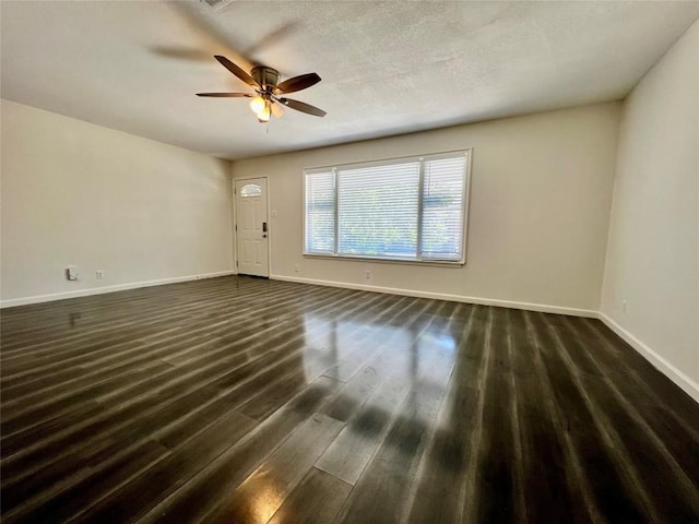 3500 Loyola Ln, Austin, TX 78723 - unfurnished room with baseboards, ceiling fan, and dark wood finished floors
