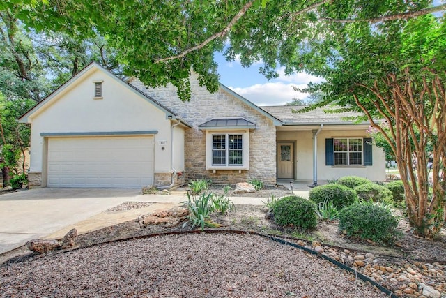 401 Texas Dr, Georgetown, TX 78633 - view of front facade with stucco siding, stone siding, concrete driveway, and an attached garage