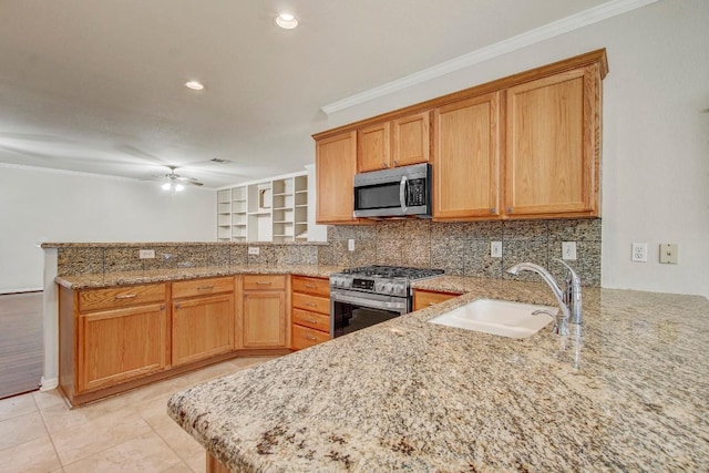 401 Texas Dr, Georgetown, TX 78633 - kitchen featuring appliances with stainless steel finishes, a peninsula, ornamental molding, backsplash, and a ceiling fan