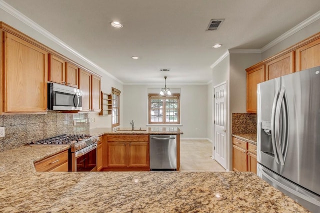 401 Texas Dr, Georgetown, TX 78633 - kitchen with stainless steel appliances, decorative backsplash, a peninsula, ornamental molding, and recessed lighting