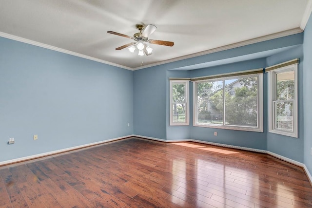 401 Texas Dr, Georgetown, TX 78633 - spare room with hardwood / wood-style floors, ceiling fan, baseboards, and ornamental molding