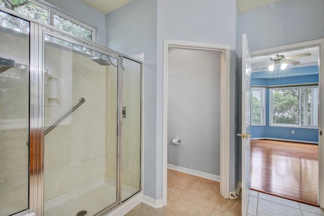 401 Texas Dr, Georgetown, TX 78633 - full bathroom featuring plenty of natural light, a stall shower, and a ceiling fan