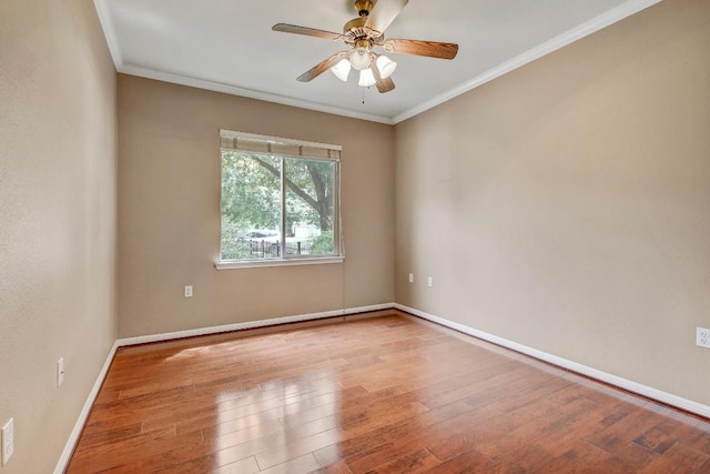 401 Texas Dr, Georgetown, TX 78633 - spare room with ceiling fan, crown molding, wood finished floors, and baseboards