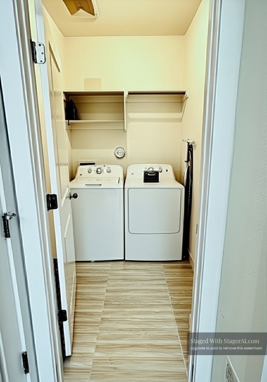 2376 Sawdust Dr, Georgetown, TX 78633 - washroom with washing machine and dryer and light wood-style flooring