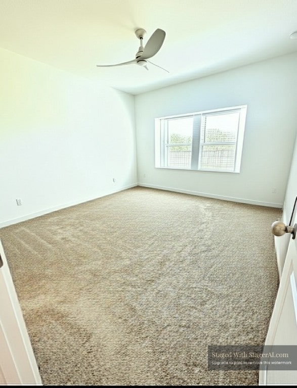 2376 Sawdust Dr, Georgetown, TX 78633 - carpeted spare room with ceiling fan and baseboards