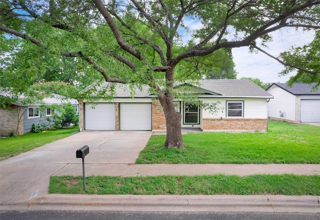 410 Blueberry Hl, Austin, TX 78745 - view of front facade featuring brick siding, driveway, and a front lawn
