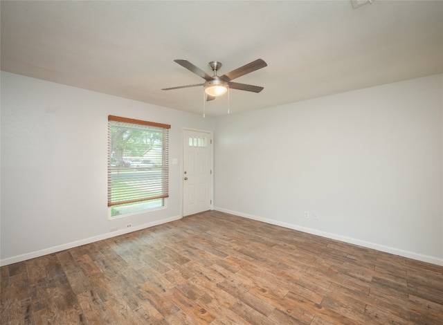 410 Blueberry Hl, Austin, TX 78745 - unfurnished room featuring wood finished floors and ceiling fan