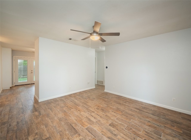 410 Blueberry Hl, Austin, TX 78745 - spare room with wood finished floors and ceiling fan