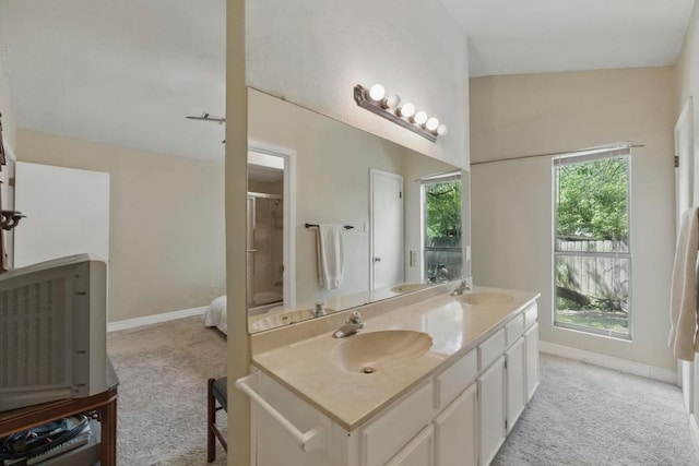 4802 Peach Grove Ct, Austin, TX 78744 - full bathroom with double vanity, an enclosed shower, and baseboards