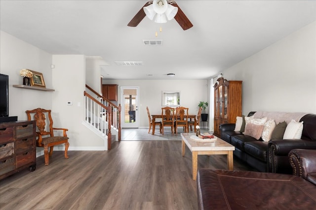 228 Wallops, Kyle, TX 78640 - living room featuring ceiling fan, stairway, wood finished floors, and baseboards