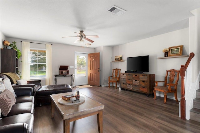 228 Wallops, Kyle, TX 78640 - living area featuring ceiling fan, dark wood-type flooring, stairway, and baseboards