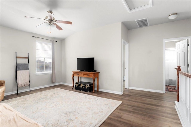 228 Wallops, Kyle, TX 78640 - living area featuring wood finished floors, a ceiling fan, baseboards, and attic access