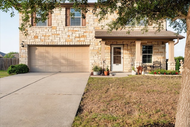 228 Wallops, Kyle, TX 78640 - view of front of home with a garage, concrete driveway, and stone siding