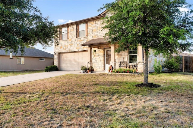 228 Wallops, Kyle, TX 78640 - view of front of home featuring stone siding, a garage, and concrete driveway