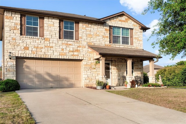 228 Wallops, Kyle, TX 78640 - view of front of home with a garage, stone siding, driveway, and roof with shingles