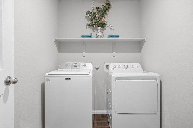 19825 Abigail Fillmore Rd, Manor, TX 78653 - laundry room with washing machine and dryer and dark wood-style flooring