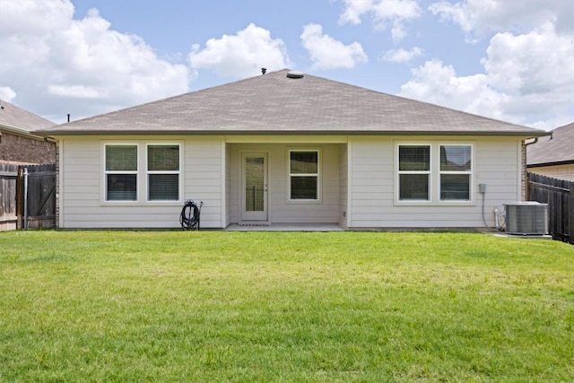 19825 Abigail Fillmore Rd, Manor, TX 78653 - back of property with a fenced backyard and a shingled roof