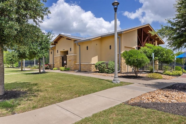 19825 Abigail Fillmore Rd, Manor, TX 78653 - view of front of house featuring stucco siding and stone siding