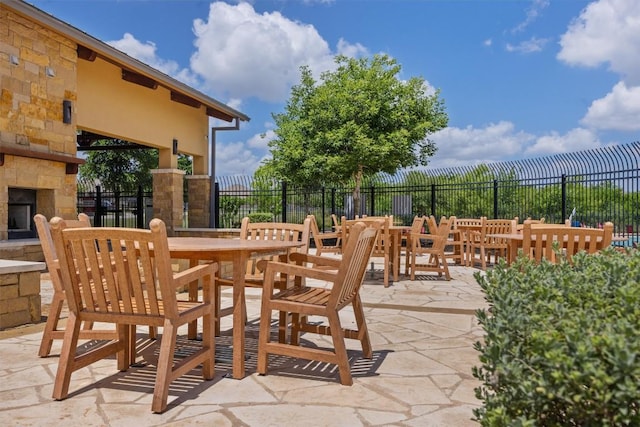 19825 Abigail Fillmore Rd, Manor, TX 78653 - view of patio / terrace featuring an outdoor stone fireplace and outdoor dining space